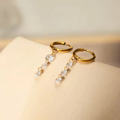 Gold Huggie Hoop Earrings with Dangling Zircon Stones – Elegant Minimalist Jewellery - DZOIR